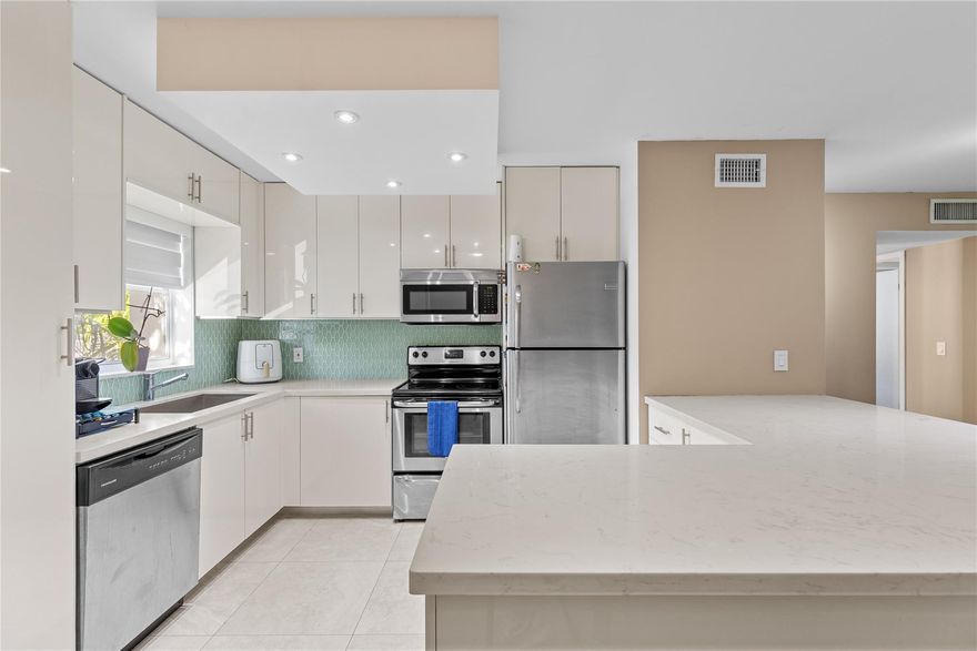 Beautifully updated 2 bed, 2 bath condo in highly desirable alpine woods of Davie! this top-floor unit offers a bright and open floor plan with plenty of natural light. Renovated kitchen features stainless steel appliances, white cabinetry, quartz countertops, and a modern backsplash. Spacious bedrooms with ample closet space and newly renovated baths. Enjoy your morning coffee or evening sunset from the screened-in balcony overlooking the peaceful canal. in-unit laundry for convenience. Community amenities include pool, clubhouse, tennis & basketball courts. Amazing location close to nova, Broward college, shopping, dining, and major highways. Move-in ready and perfect for investors or owner-occupants alike!