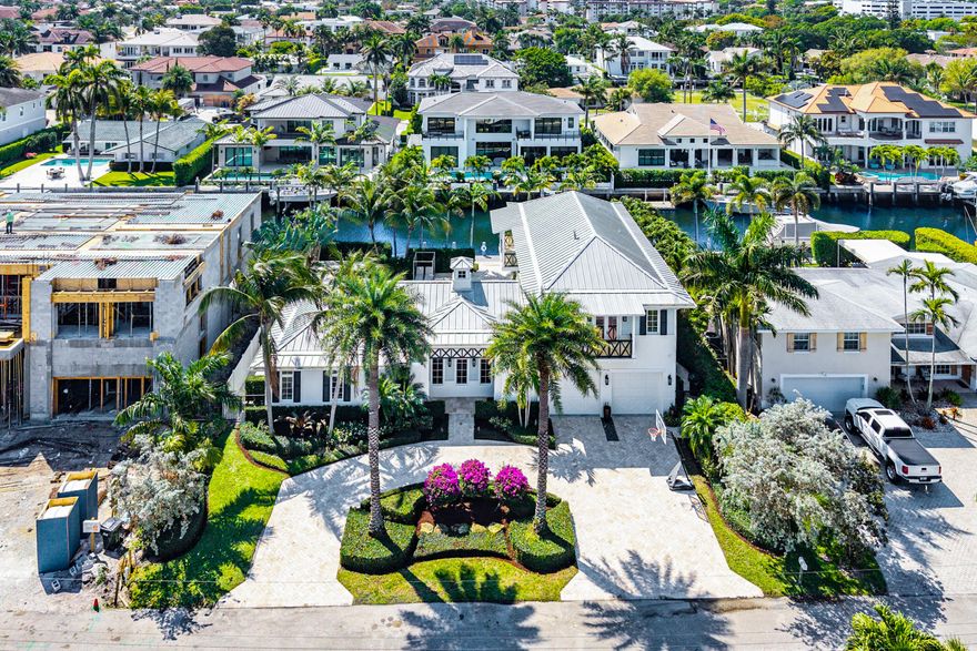 Experience the pinnacle of waterfront living in prestigious Tropic Isle, featuring 4 spacious ensuite bedrooms, 4 full and 2 half baths.  This home blends timeless elegance with modern upgrades throughout.  Perfectly positioned with coveted southern exposure, the residence is filled with natural light and showcases stunning water views.  The chef's kitchen is a true showpiece, featuring top-of-the-line Wolf, Sub-Zero, and Miele appliances, dual dishwashers, a veggie sink, pot filler, steamer, and coffee maker-ideal for effortless entertaining.  Enjoy seamless indoor-outdoor living with a resort-style pool, spa, and sun shelf.  The newer dock is  complete with boat lift and floating platform ideal for water toys.   Additional features include a full house generator.   Ideally located just minutes from the pristine beaches of Delray and only 2 miles from vibrant Atlantic Avenue, offering world-class dining, shopping, and nightlife.  Enjoy the best of South Florida waterfront living!