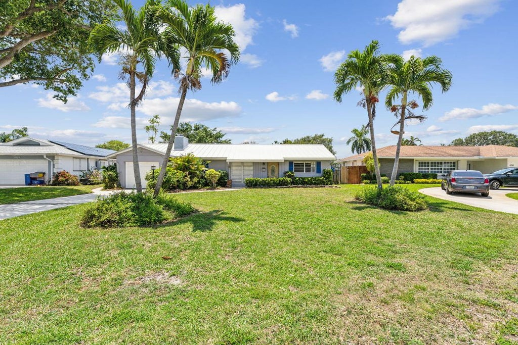Photo of 4194 Honeysuckle Avenue, Palm Beach Gardens, FL 33410 (MLS # R11016798)