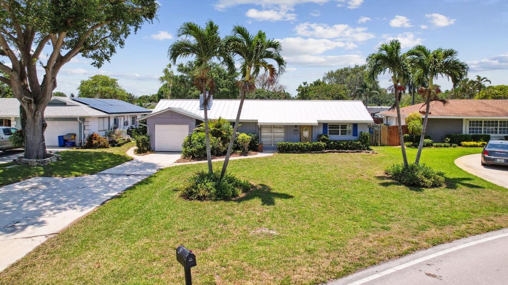 Photo of 4194 Honeysuckle Avenue, Palm Beach Gardens, FL 33410 (MLS # R11016798)