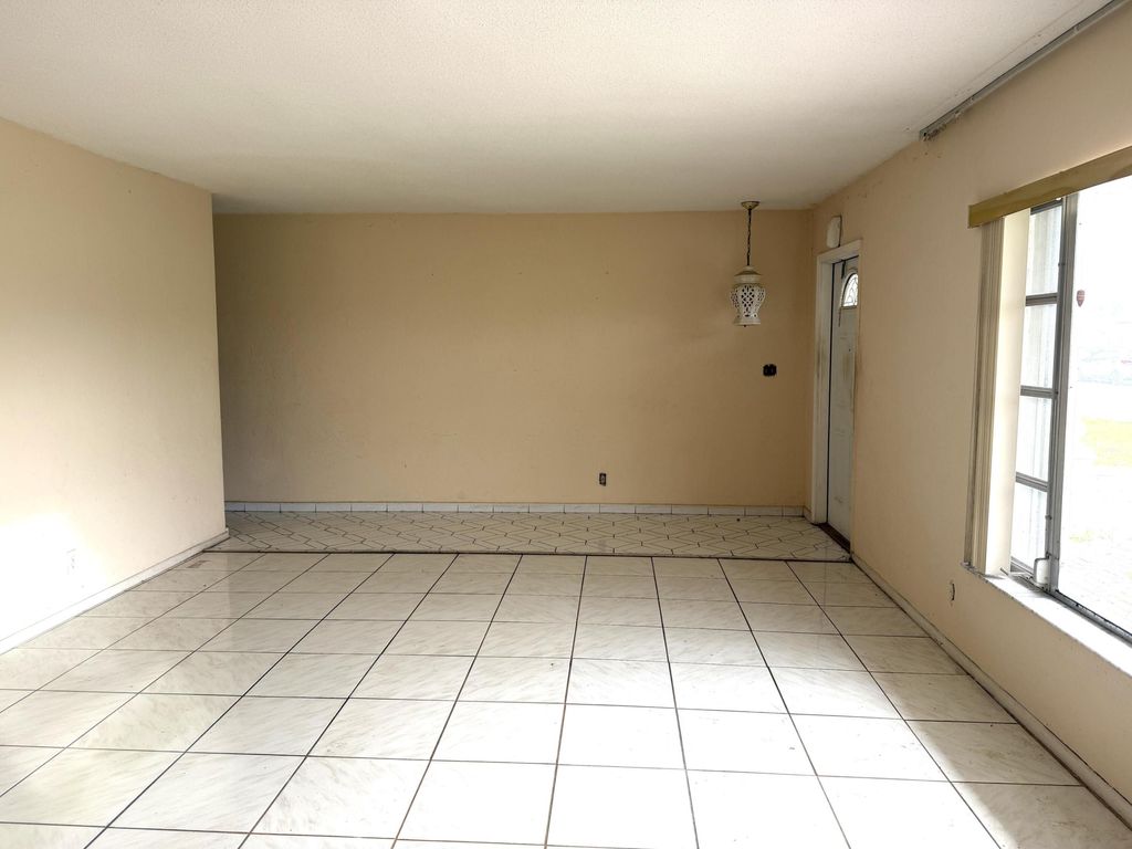 Photo of 9210 NW 73rd Street, Tamarac, FL 33321 (MLS # B26013705)