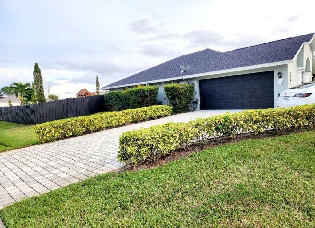 Photo of 3401 SW San Benito Street, Port Saint Lucie, FL 34953 (MLS # R10992925)