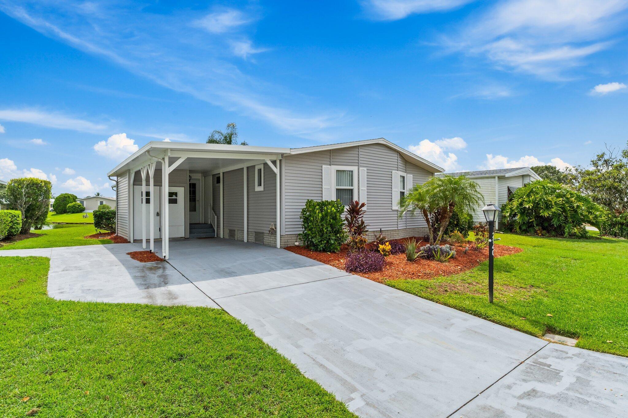 Own Your Land- Lakefront 2 BR/2BA in the desirable Savanna Club 55+ community. Enjoy your morning coffee with lake views on your 34' enclosed ac'd glass lanai or soak in the included hot tub. Home is move in ready with a 2025 roof, impact windows, upgraded electrical, tile and vinyl throughout and the '57 Chevy styled golf cart is included too! All measurements approximate, buyer to verify.