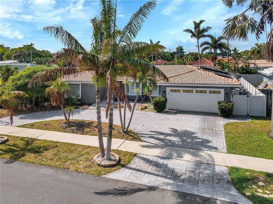 Enjoy a Florida lifestyle in this Beautiful 3/2 home with 2 car garage in desirable Imperial Point. Completely updated. Screened in backyard, paved patio and pool. Solar panels on roof, enjoy the benefits of discounted savings on electric bills. Gourmet kitchen with stainless steel appliances and wine cooler.  Large open floor plan perfect for entertaining. Spacious master bedroom with 3 closets. Hardwood and tile floorings through-out the home. Ample storage through-out the home. HE Washer and Dryer. Impact windows and doors. Circular Paver driveway. Convenient location to private schools, public schools, shopping, restaurants, golfing, fitness centers, boating, parks and the beach.