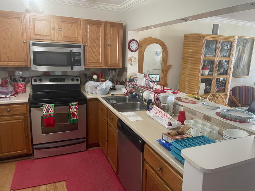 Spacious 2/2 in building with elevator! This nicely updated condo also has washer and dryer inside the unit! Engineered hardwood throughout, updated kitchen with stainless steel appliances, AC replaced in 2017, accordion shutter hurricane protection throughout, walk in closets in both rooms! Partially furnished or can be purchased cleared out... HURRY, this is the best deal in the community!!!