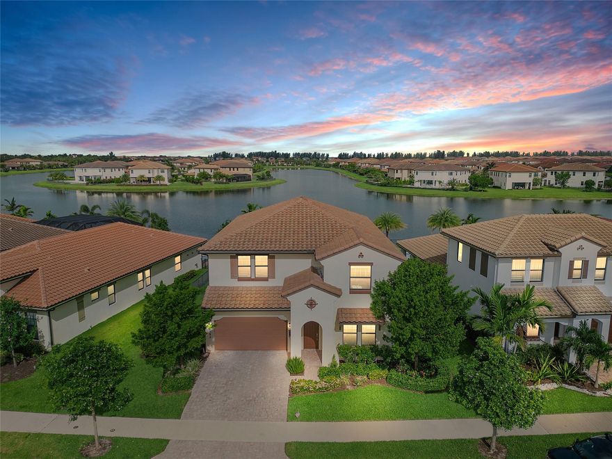 Come see this highly desired Pelican model on an oversized lot with a heated pool and spa! Enjoy the jaw dropping sunsets every night on one of the best lake views in all of Parkland. This model features an open floorplan 4/3.5 bedroom/bath, plus an office (could be a 5th), formal dining, loft upstairs, sitting area in the master and water views from most rooms and windows. Oversized fully fenced yard with an full size deck, heated salt water pool (12x32) with spa (7x7)and privacy bushes on each side and outdoor speakers for entertainment. Interior features wood look porcelain tile downstairs, upgraded white cabinetry in kitchen with upgraded countertops and backsplash, custom closets in master and bedroom 2, roof spray insulation in the attic for and much more.