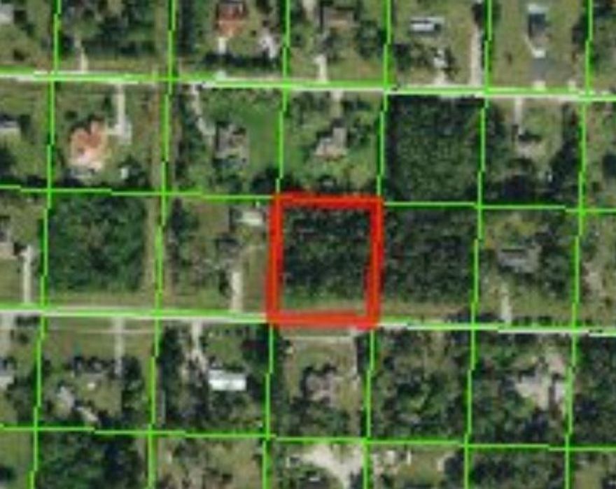 Possibly the best priced home site in the Acreage that is on a paved road. Easy access to both  Seminole Pratt & Whitney Blvd and Okeechobee Blvd. High and dry and surrounded by nice homes. Ready for your dream home!