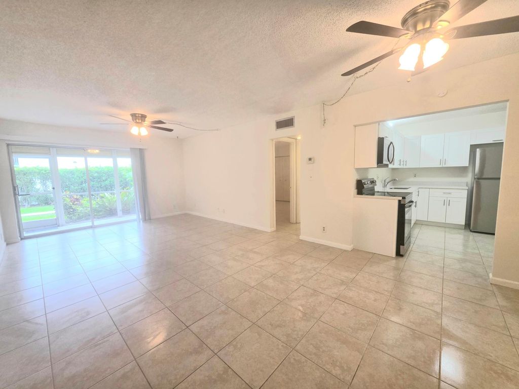 Photo of 959 SE 2nd Avenue #Apt 101, Deerfield Beach, FL 33441 (MLS # B26028282)