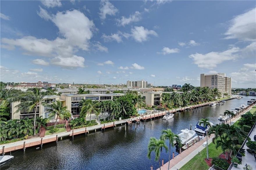 RIDGEVIEW TOWERS is in a fantastic East location!!  Very large 2 bedroom/2 bath condo w/1450 sq ft on 5th floor (7 total). Open updated kitchen, *STACKABLE WASHER & DRYER* (in cabinet left of fridgerator), granite counter top & bar top, plus stainless appliances, updated bathrooms, good sized walk-in closets in bdrms, open balcony with view of canal & intracoastal waterway right outside primary bedroom. ALL 3 EXTERIOR DOORS, LOCKS & DOOR NUMBERS ARE NEW, A/C installed 2015. Heated community pool, plenty of guest parking, updated lobby & elevators. 1 Covered parking space in secure parking garage.  *New carpet in both bdrms will be installed on 2/15/21*  Bike, walk or drive to the ocean, Lauderdale By The Sea, shopping & quality restaurants in minutes!   Vacant & easy to show!  BRING OFFER!