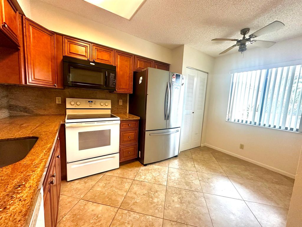 Photo of 14426 Amberly Lane #203, Delray Beach, FL 33446 (MLS # R11154637)