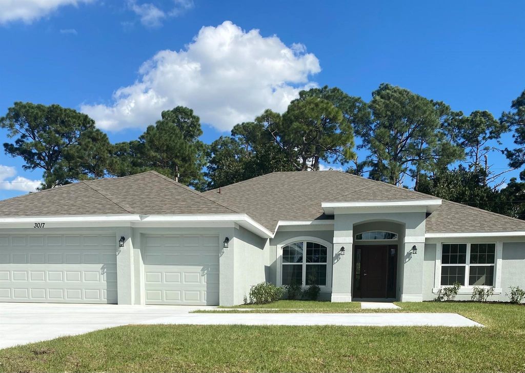 Photo of 3017 SW Savona Boulevard, Port Saint Lucie, FL 34953 (MLS # R10955526)
