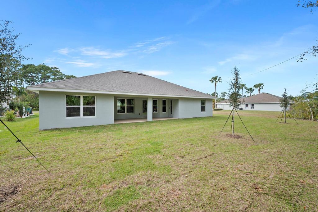 Photo of 3017 SW Savona Boulevard, Port Saint Lucie, FL 34953 (MLS # R10955526)