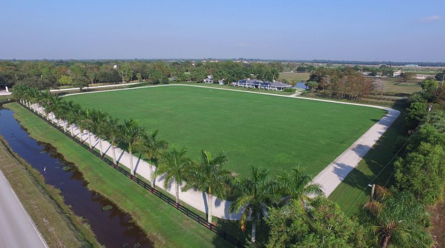 This immaculate 10 acre property has been designed by top equestrian professionals. The property consists of a 12-stall barn, stick and ball field, exercise track and beautiful paddocks. There are four separate dwellings with the Caribbean feel and style that everyone will fall in love with! The main dwelling has an open floor plan which flows into a beautiful garden with a tropical landscape designed pool. The two cabana houses are perfectly placed for privacy and relaxation. There is a luxurious 2 bedroom, 1 bath staff quarters, ample storage and great parking. Certainly this property will suit any discipline and is located in close proximity to WEF, GDF and IPC. One of the finest estates available in Wellington!!