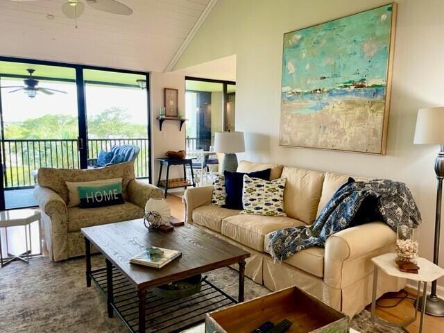 Beautiful Intracoastal views complement this lovely furnished condo, designed for both comfort and style. Enjoy a spacious screened-in balcony, the perfect spot to watch yachts glide by while relaxing and taking in the serene waterway views. The interior features vaulted ceilings and an open concept layout, enhancing the bright and airy coastal ambiance.The generously sized master bedroom boasts picturesque intracoastal views. The 3rd bedroom enjoys a sofa bed, desk, and charming French doors overlooking the waterway. Additional amenities include a manned entrance, a designated carport, and extra storage, making life here effortless.The pool also overlooks the Intracoastal & lots of green spaces, walking paths, and tennis courts, all add to its inviting charm.