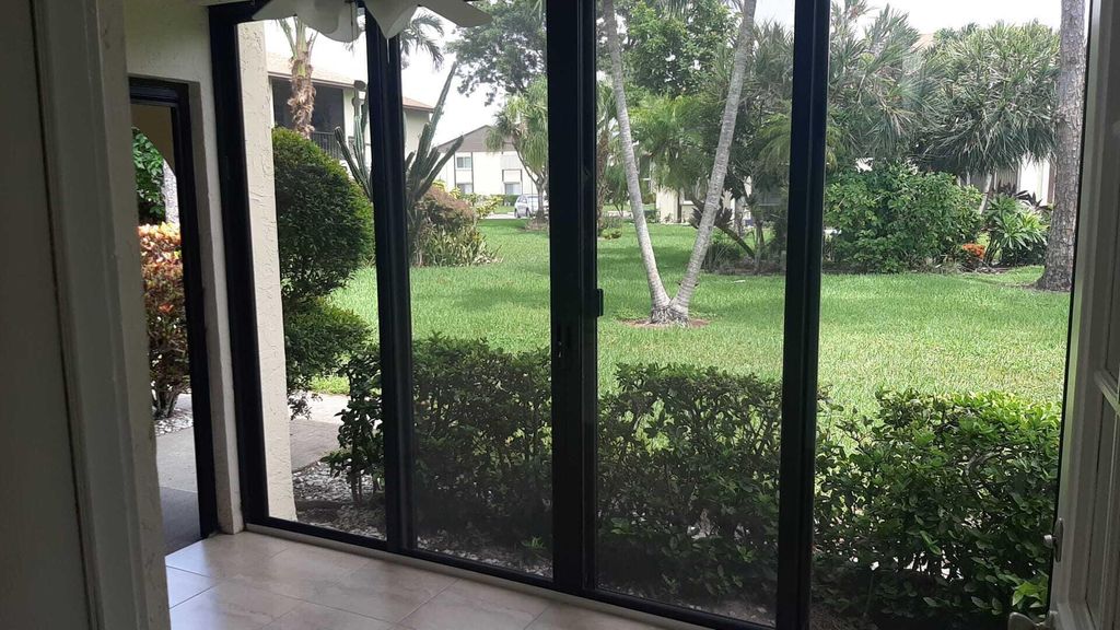 Photo of 5990 Pine Cone Court #C-1, Greenacres, FL 33463 (MLS # R11144248)