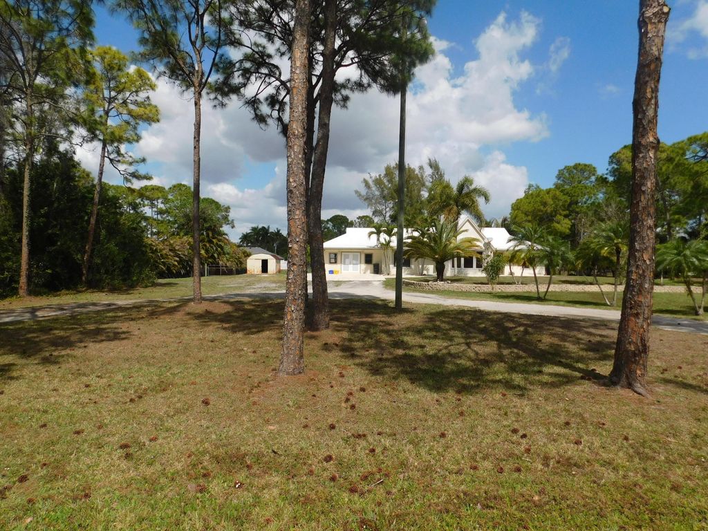 Photo of 11065 N 67th Place N, West Palm Beach, FL 33412 (MLS # B26000028)