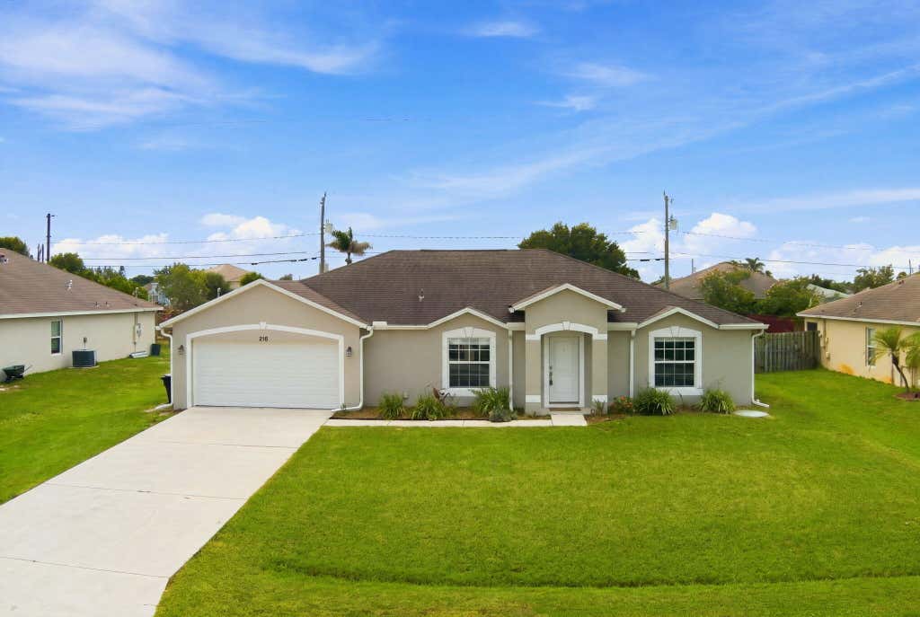 Photo of 216 SW Kestor Drive, Port Saint Lucie, FL 34953 (MLS # B26059428)