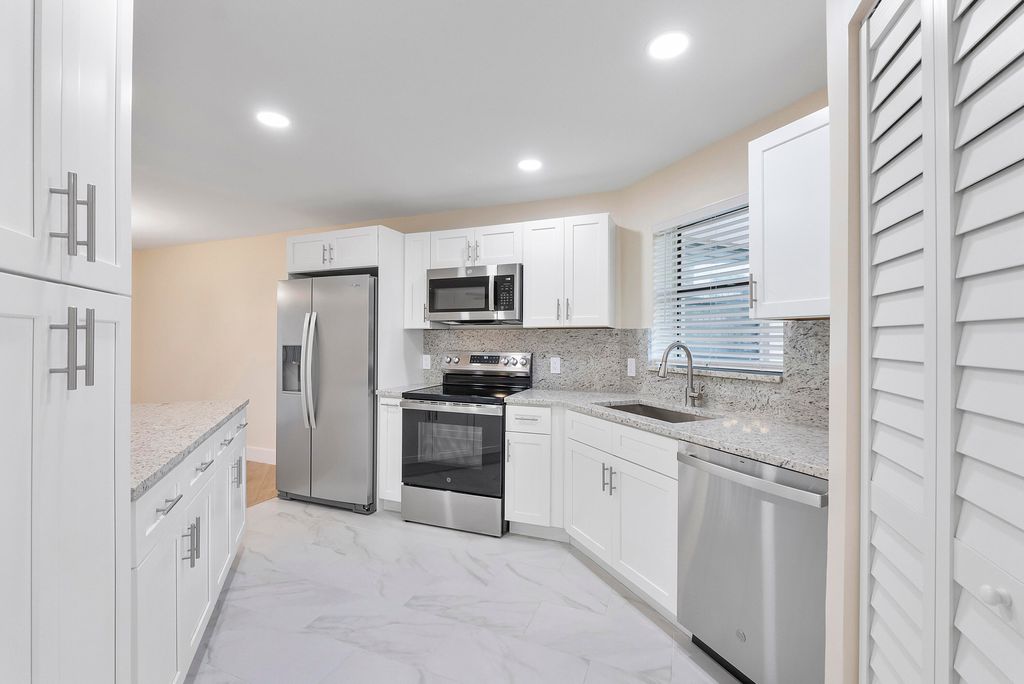 Photo of 6855 W Broward Boulevard #112, Plantation, FL 33317 (MLS # B26000713)