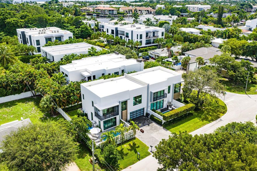 Designed by Richard Jones and built by Southshore Builders, this 3,133+/- TSF townhouse blends sleek modern design with refined finishes. High ceilings, urban tile, and white oak floors set a sophisticated tone throughout. Just a half mile to the beach and 1.5 miles from Delray's Atlantic Avenue, the location is ideal for a true coastal lifestyle.A dramatic two-story entry opens to a light-filled great room and a chef's kitchen with a large island, waterfall counters, custom cabinetry, and top-tier appliances. Pocket sliders extend the living space to a private patio and a second outdoor retreat with a heated resistance pool, all surrounded by lush landscaping that ensures total privacy.