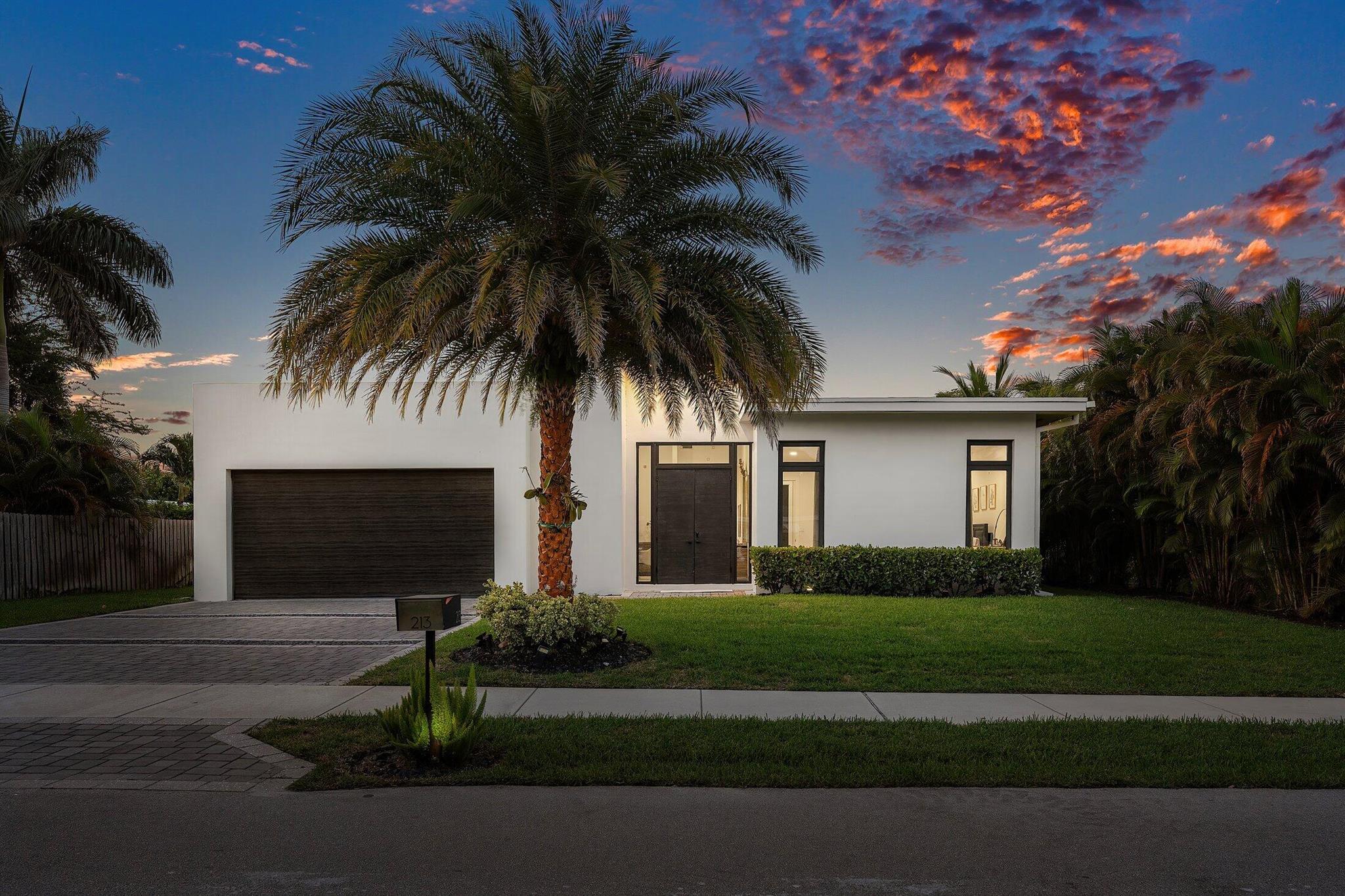 Modern luxury just moments from Downtown Delray & the beach! This distinctive 4BR/3BA home sits on a .26-acre lot and offers 3,000 SF under air, blending contemporary design with comfort and function. Built in 2020, this residence features 48x24 porcelain tile, impact glass throughout, recessed lighting, linear diffusers, and a formal dining room. The chef's kitchen boasts leathered quartz countertops, waterfall island, Wolf/Sub-Zero appliances, custom cabinetry, and a walk-in pantry. The spacious primary suite offers pool access, dual custom closets, and a spa-like bath with floating vanities, soaking tub, step-in shower, and designer finishes. VIP guest suite includes its own ensuite bath and cabana access. Two additional bedrooms share a stylish hall bath.