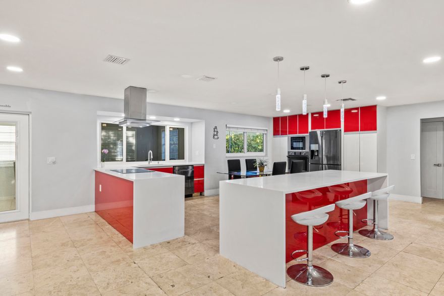 Step into a home that blends modern design with everyday comfort, perfectly situated in the highly desirable community of Lake Clarke Shores. From the moment you arrive, the wide frontage and circular driveway create a welcoming first impression with ample space for family and guests.  Enjoy an open layout with lots of natural light and a clean, modern feel, fully updated kitchen featuring bold contemporary cabinetry, expansive quartz countertops, and a large island, ideal for entertaining, casual meals, or gathering with loved ones. Clean lines and high-end appliances make it as functional as it is eye-catching.  The living spaces are designed for both relaxation and connection, with an elegant media wall that creates a true focal point for movie nights or quiet evenings at home. Large windows and soft, neutral tones throughout give the home a bright, calming feel, while the spacious layout offers flexibility for your lifestyle.  There's ample yard space for a pool, outdoor kitchen, or garden retreat, all framed by mature greenery for added privacy.  Recent updates include a new built-in convection microwave, 2026 garage door motor, 2023 A/C, 2017 roof, and 2017 tankless water heater. Beyond the home itself, what truly sets this property apart is its location. Lake Clarke Shores is known for its peaceful, family-oriented environment, where neighbors connect, streets are quiet, and outdoor living is part of daily life. For boating and water enthusiasts, you'll love the convenient access to the Lake Clarke Shores Public Boat Ramp, just about 0.8 miles away, only 2-3 minutes by car or a quick 10-minute bike ride. Enjoy easy access to the lake with dock facilities, making it effortless to spend weekends on the water, kayaking, fishing, or simply unwinding by the shoreline. There's ample yard space for a pool, outdoor kitchen, or garden retreat, all framed by mature greenery for added privacy. This home is perfect for buyers who appreciate modern style, open-concept living, and the unmatched lifestyle that comes with living in a welcoming waterfront community.