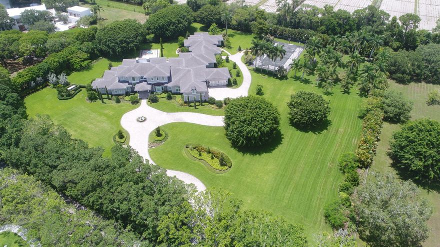 SPECTACULAR 2015 BUILT, 17,929 +/- TOTAL SQ. FT. PRIVATELY GATED ESTATE SITED ON A LUSH 5 +/- ACRE LOT ON THE ONLY GATED STREET IN HORSESHOE ACRES, AN EQUESTRIAN COMMUNITY IN THE HEART OF BOCA RATON. TRANSITIONAL CONTEMPORARY IN STYLE, THIS AMAZING RESIDENCE FEATURES BEAUTIFULLY MANICURED PRIVATE GROUNDS W/TENNIS COURT, 6-CAR GARAGE & ATTACHED 2 BR/2.5 BA GUEST HOUSE W/PRIVATE ENTRANCE. ONLY THE FINEST FINISHES THROUGHOUT INCLUDING IMPACT GLASS, MAGNIFICENT CHEF'S KITCHEN OPENS TO A LARGE FAMILY ROOM W/TRANQUIL VIEW OF THE POOL AREA & GROUNDS, SUMPTUOUS MASTER SUITE W/HIS & HER BATHS,  GAME ROOM/HOME THEATER W/ WET BAR,  CLUB ROOM, LAUNDRY/CRAFT ROOM & HUGE 2ND FLOOR PLAYROOM & ELEVATOR. ALL THIS IDEALLY LOCATED CLOSE TO FINE DINING, PREMIER SHOPPING, MAJOR HIGHWAYS, AIRPORTS AND BEACHES.