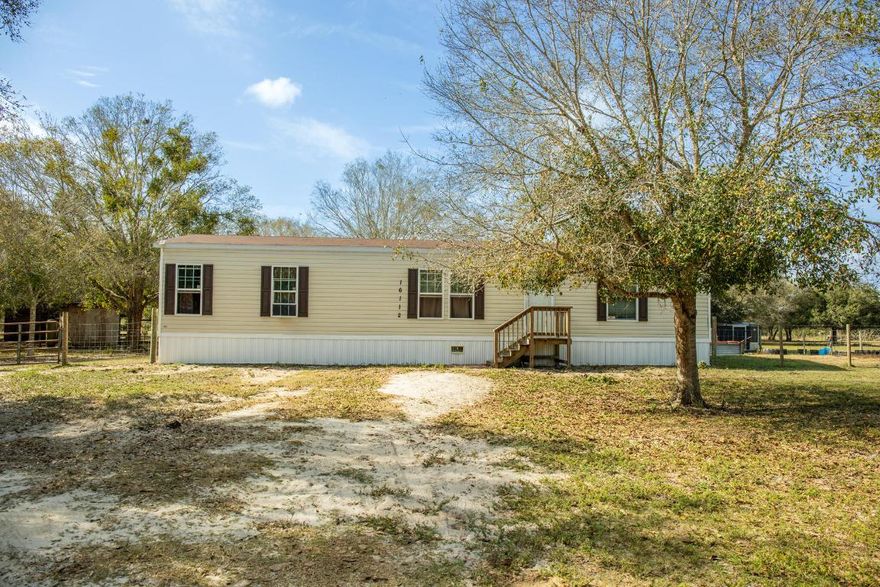 A MUST - SEE HOMESTEADER'S PARADISE! Welcoming a Private 7.5 Acres Plus 2.5 Acres totaling 10 Stunning Acres you can enjoy the Peace and Privacy! Perfect for livestock, A nice size Pond on the property it Also Features a 2021 Mobile home 3 bedroom 2 full bathrooms, walk-in closets in all bedrooms, 1325 sq ft of living space- ideal for comfortable modern living, that's not all, this property is currently Agricultural exempt keeping taxes low. This property also has a charming log cabin, Pole barn for storage and equipment, and an above ground pool, Oh and all 10 acres Fenced in! Don't miss your chance to own this incredible Property-schedule you're showing Today!