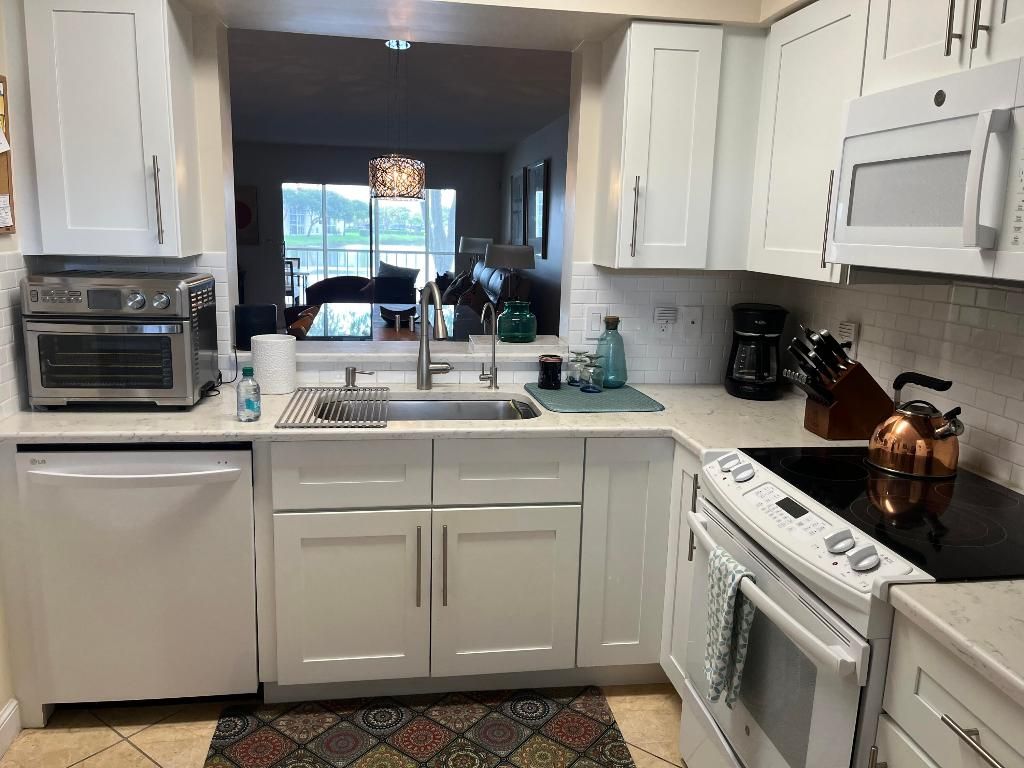 Photo of 6080 Huntwick Terrace #205, Delray Beach, FL 33484 (MLS # R11019624)