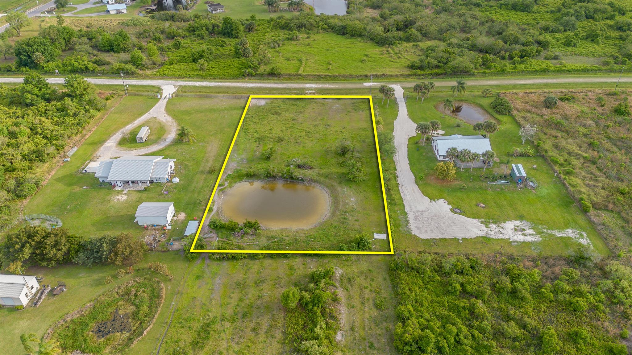 VICKING LOT-Beautiful improved lot- HIGH AND DRY, cleared, fenced, large pond, the lot is located in between two existing homes making power placement simple, culverts already placed for access, and it's directly off the paved road. No HOA! This lot is PERFECT for your new home. Call the listing agent for more details.Measurements are approximate.