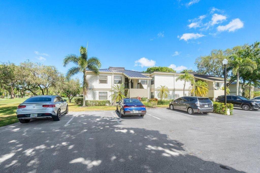 Photo of 12962 Briarlake Drive #101, Palm Beach Gardens, FL 33418 (MLS # R10991312)
