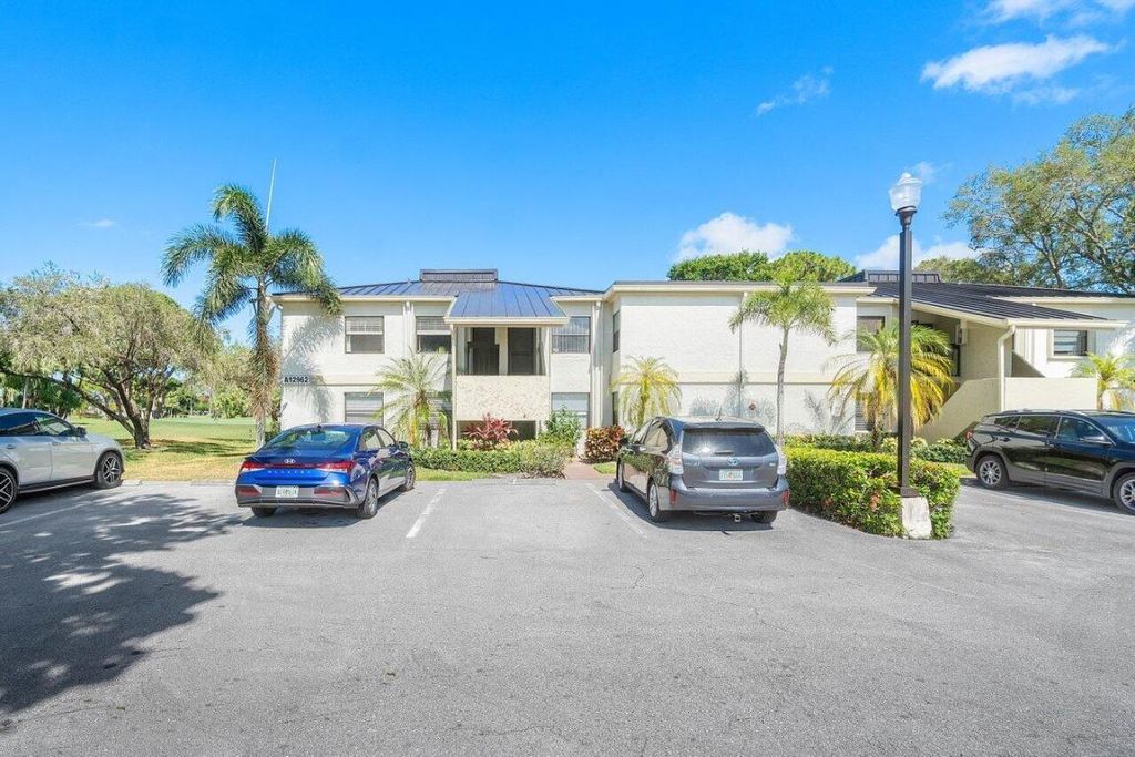 Photo of 12962 Briarlake Drive #101, Palm Beach Gardens, FL 33418 (MLS # R10991312)