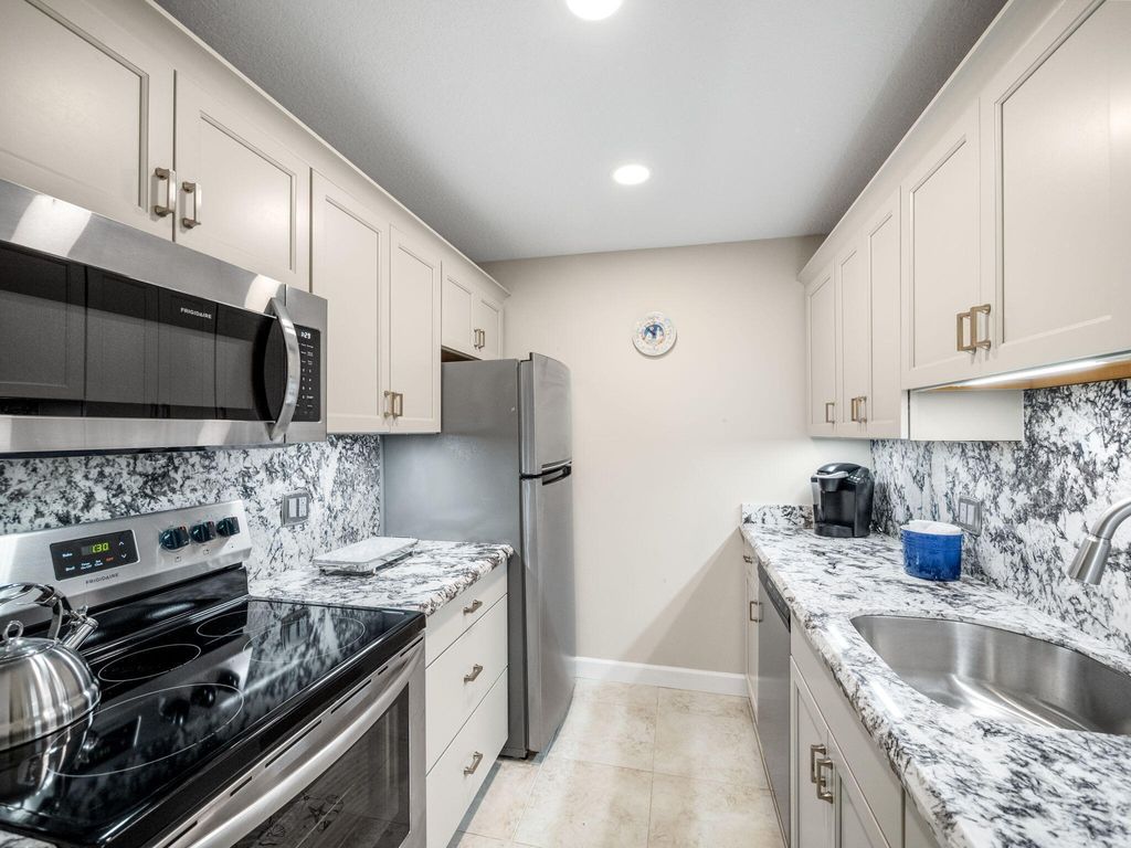 Photo of 131 Doolen Court #103, North Palm Beach, FL 33408 (MLS # B26009873)