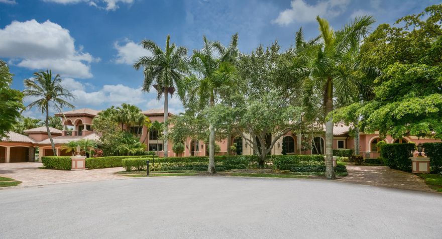 This refined European-inspired masterpiece is situated on .89 acres with 475 feet of panoramic lake front and golf course views. A graceful arched entry sets the timeless tone of this 6 bedroom 8.3 bath residence with 13,962 square feet under air. The classic look is fashioned with custom architectural elements, exquisite designer finishes, marble and wood floors and stunning ceiling treatments throughout. The flow functions beautifully for entertaining with French doors to the outdoor living room and garden terrace and luminous infinity pool in a relaxing resort-like oasis. Notable features of the home include the authentically designed theater room, family room with pub, billiard room, a grand master suite wing with a rich wood paneled library with bath, a second office,