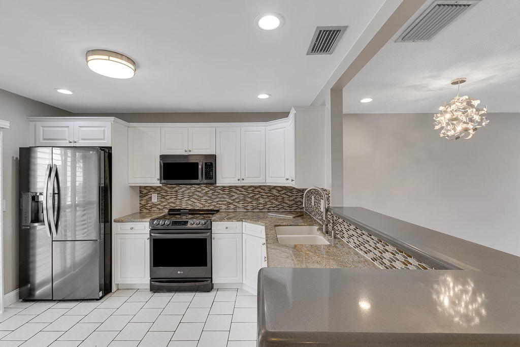 Photo of 423 NARROWLEAF Court, Royal Palm Beach, FL 33411 (MLS # B26074558)