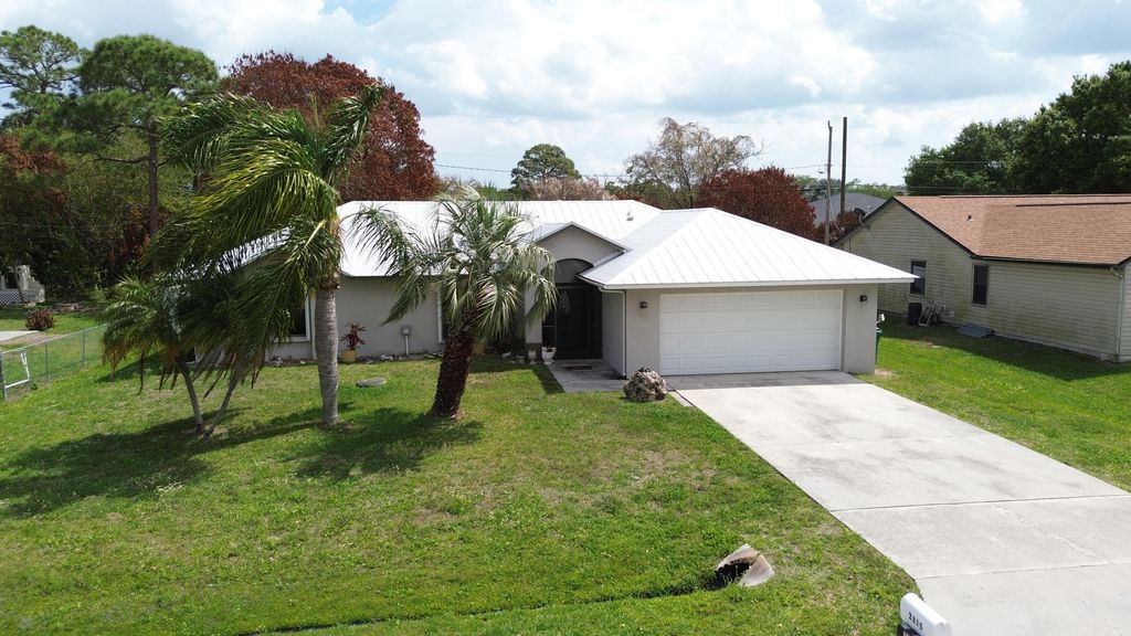 Photo of 2325 SE Beechwood Terrace, Port Saint Lucie, FL 34952 (MLS # B26002955)