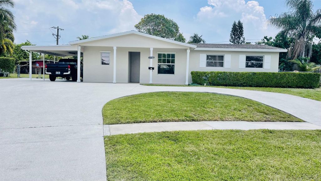 Photo of 12244 Hillman Drive, Palm Beach Gardens, FL 33410 (MLS # R10892027)