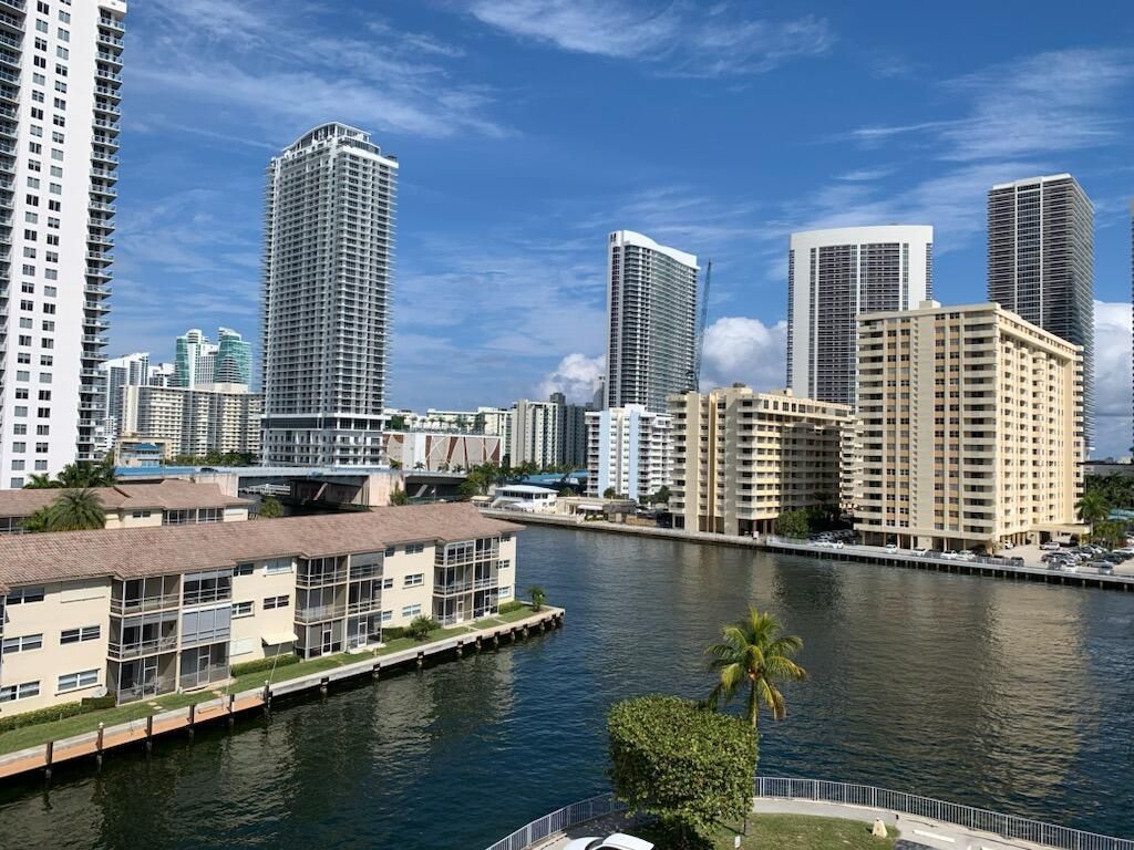 Photo of 100 Golden Isles Drive, Hallandale Beach, FL 33009 (MLS # B26021040)