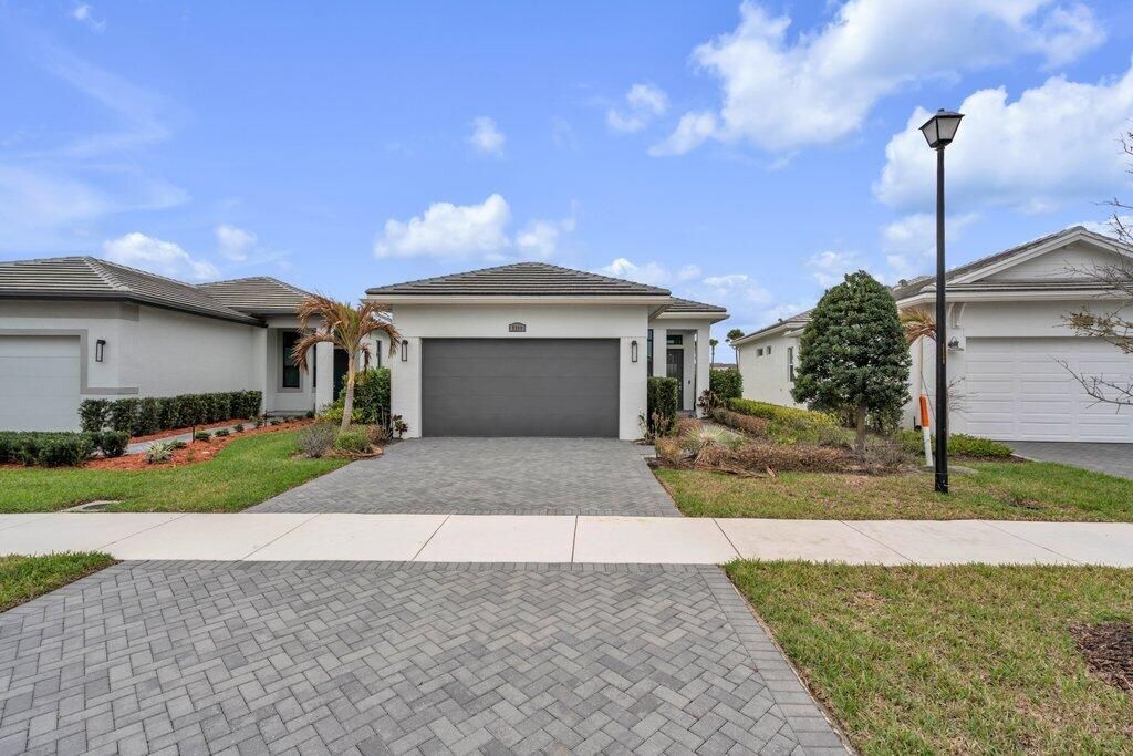Photo of 9399 SW Pepoli Way, Port Saint Lucie, FL 34987 (MLS # B26001866)