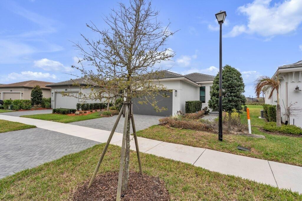 Photo of 9399 SW Pepoli Way, Port Saint Lucie, FL 34987 (MLS # B26001866)