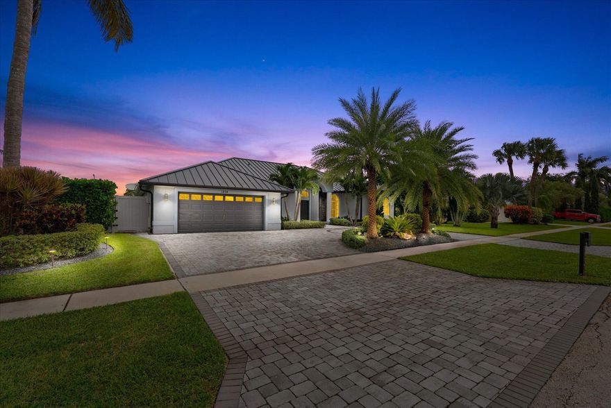 Claim your piece of paradise with this Wellington Charmer. New Metal Roof in 2022. Renovated with 4 main bedrooms and 3.5 bathrooms + a bonus room/den with side entry door. The fully fenced-in backyard is a private oasis with mature clusia hedges, renovated stone pavered deck, crisp aqua blue pool, fully equipped custom patio bar. Large covered lanai with LED lights to brighten up your evening entertaining. 2 car garage with rubber flooring, and custom storage. Extended circular driveway the maximize guest parking spots. Open split floor plan. Offering an open kitchen to the family room and a formal living room connected to a formal dining room. Accordion storm shutters. Private corner lot with spacious back & side yard. Dozens of thousands of dollars in upgraded landscaping and lighting