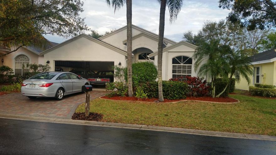 exclusive River bridge sub division, park like streets, lakes, fountains,faboulous club house. walk to shopping at publix,restaurants,minutes to wellington mall. This single home has been well kept,Brick pavers in driveway, accordion shutters through out! cathedral ceilings through out, split plan, large eat in kitchen, cabinets galore,laundry room inside,master suite has roman tub,separate shower,bright. It really is a comfortable home. covered screen patio overlooking wide canal.