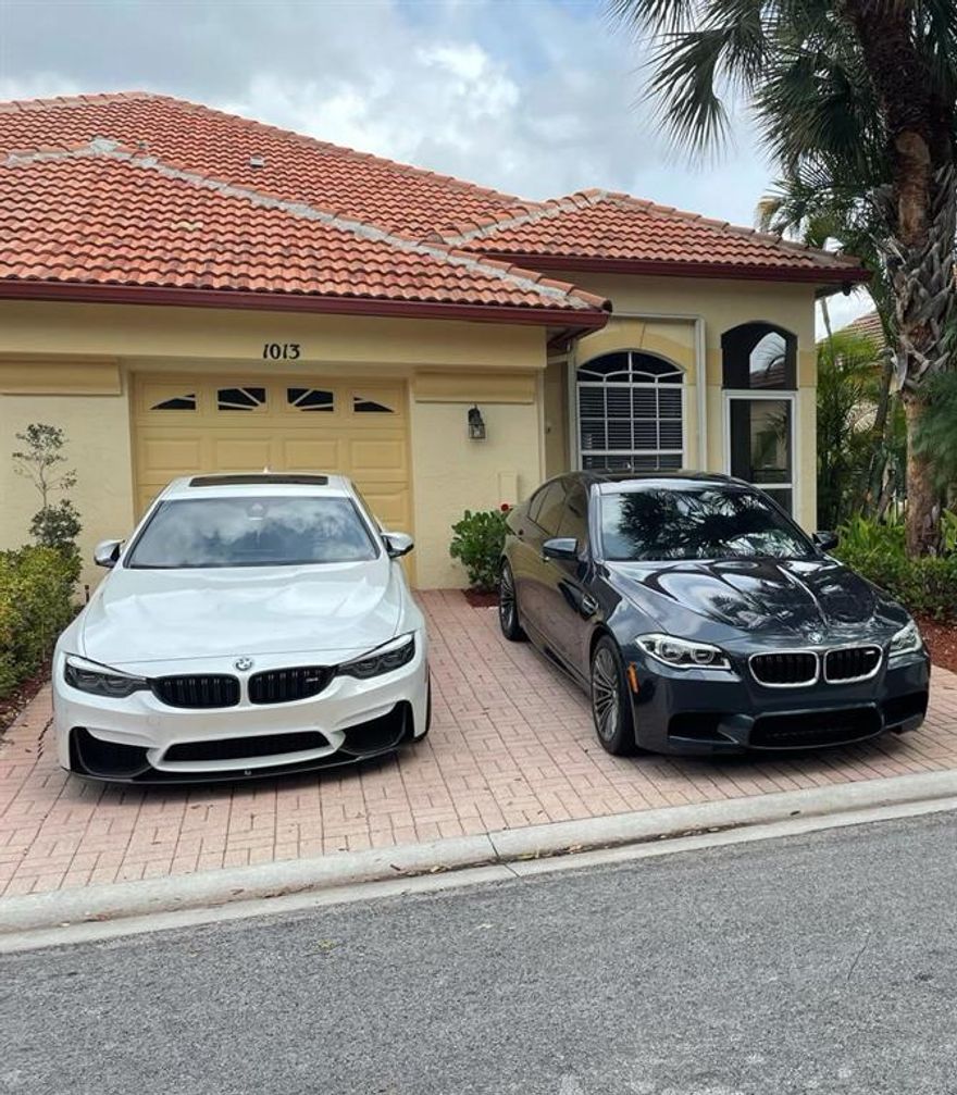 Welcome to Paradise! This beautiful, well maintained 2 Bedroom 2 Bath Townhome located on a quiet, peaceful and relaxing lake with a fenced backyard is a great way to end your workday. Park 3 cars here without a problem. 2 outside with 1 in the garage!  All new Black Stainless-Steel appliances compliment the nicely designed kitchen. Master Bedroom on first floor with a TRUE 2nd floor bedroom gives a nice separation of space. The 2nd floor bathroom is full bath and includes a separate room with professionally installed shelving! For those that are concerned about Hurricanes, this home comes with full accordion shutters along with a professionally installed generator hook-up. Association pays for sprinkler/lawn/cable basic & Internet.