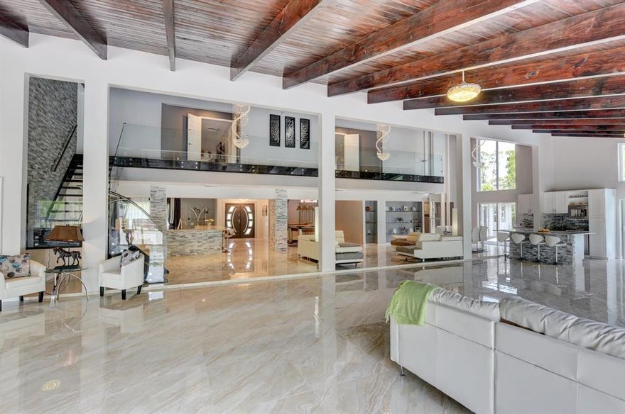 Tenants left, easy to show. .  5 acre estate in a peaceful, gated equestrian community. Modern designed 7600 sq  home renovate in 2019.Only 5 min to WEF. Groom quarters 1400 sq (4 bed) and barn just build in 2019. Jumpers/ Dressage Arena 250 x 150 professionally done. Walker. 10 Paddocks. 10 Stall .Tack and feed rooms have a/c.. The main house features open sunny floor plan, 22 ft ceilings in 2500 sq ft living room surrounded w/ sliding glass doors opening to 4000 sq ft porcelan deck, 2 heated salt pools, outdoor bar / grill area. Newly rebuilt home has new 4 Zoned HVAC, Electric, Plumbing, Metal roof, Kitchen, Smart Home system, Elevator, Energy Efficient. Movie Theater. Entertainment area for pool table, bar, walk-in wine room, built in coffee machine.