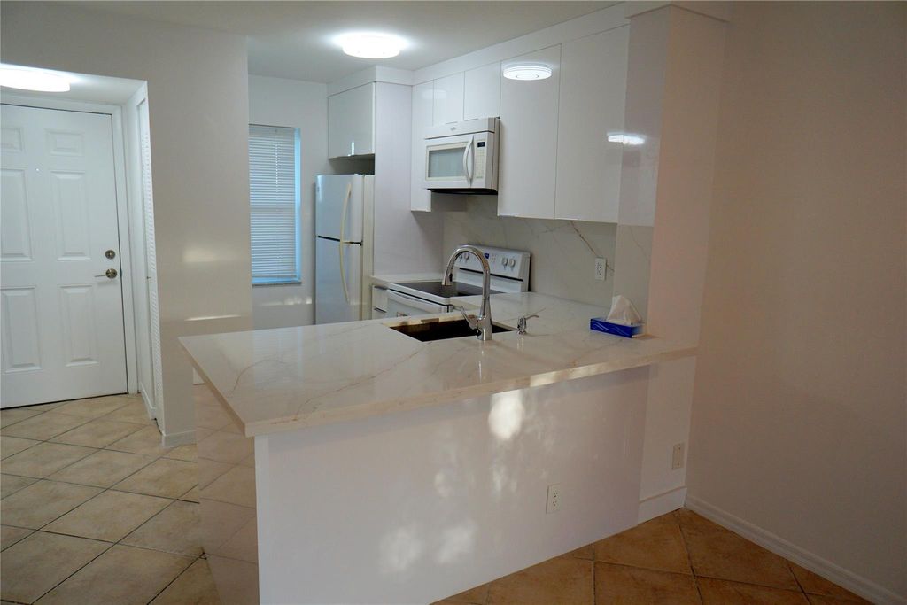 Photo of 2216 N Cypress Bend Drive #509, Pompano Beach, FL 33069 (MLS # F10480463)