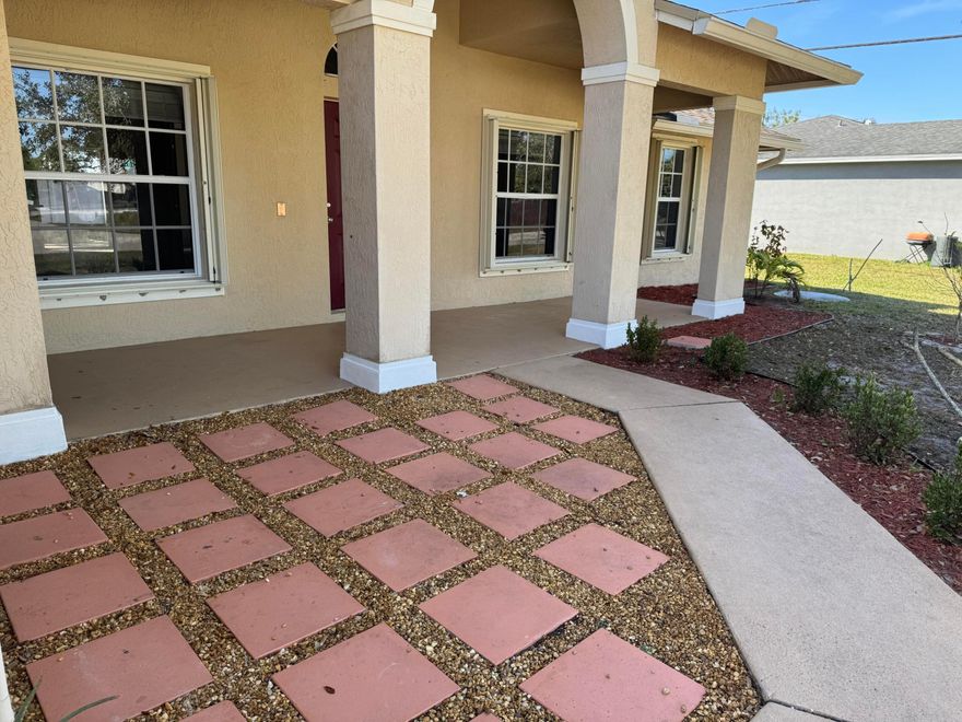 This is a perfect location for a commuter or a family that wants to be close to Tradition and St Lucie West without HOA fees and high taxes! 3/2/2 CBS just painted inside, with updated kitchen and baths sinks and cabinets, new refrigerator 2026, tile and vinyl plank flooring, roof 2018, garbage disposal 2023, microwave 2024, W/H 2025, total home water system 2018, A/C 2019, Accordion Storm Shutters 2020, and a white vinyl privacy fenced backyard large enough for a pool!  Come and see this fantastic property.
