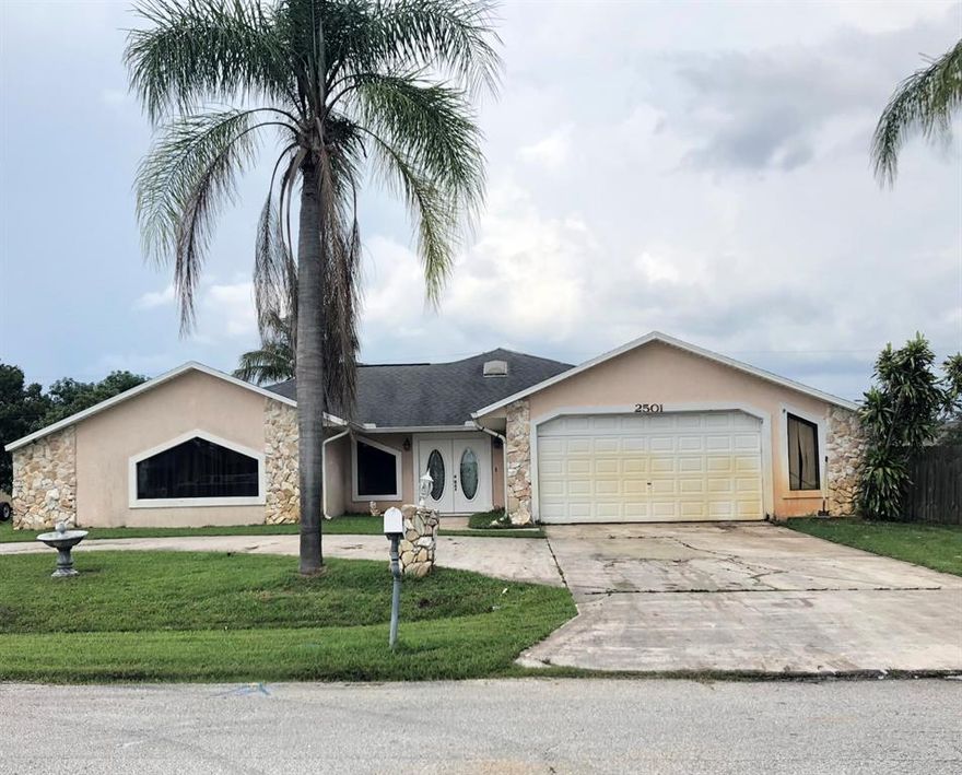 4/2/2 Pool home on 1/2 Acre with circular driveway. Almost 2600 Living Space. Impact windows. Needs updating. Investors welcome. Rare find. Up-dating considered in price.