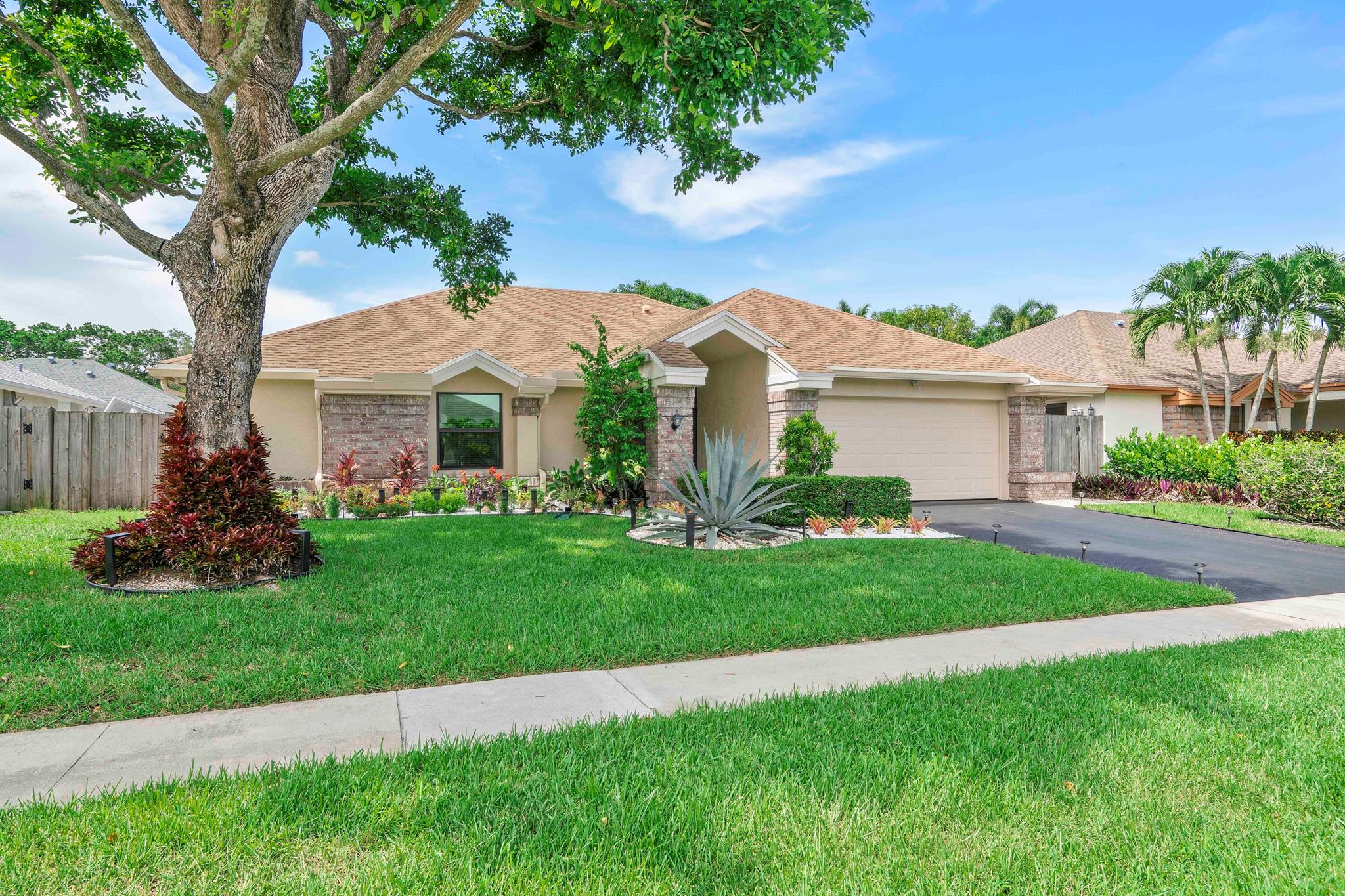 Welcome to your private oasis in the heart of West Boca! This beautifully maintained 3-bedroom, 2-bathroom pool home spans 1,808 sqft and is packed with updates that offer comfort, efficiency, and peace of mind. Enjoy Florida living at its finest with a screened-in pool featuring new Diamond Brite finish, new pool tile and lighting, a digital pool timer, and super gutters that drain seamlessly into a French drain system.The roof was replaced in 2016, and the exterior was freshly painted in 2023. Inside, you'll find a bright and airy layout, enhanced by blown-in insulation and a 2022 A/C split unit with a germicidal UV light system for improved air quality. The washer and dryer were updated in 2017, along with new plumbing for the laundry area.