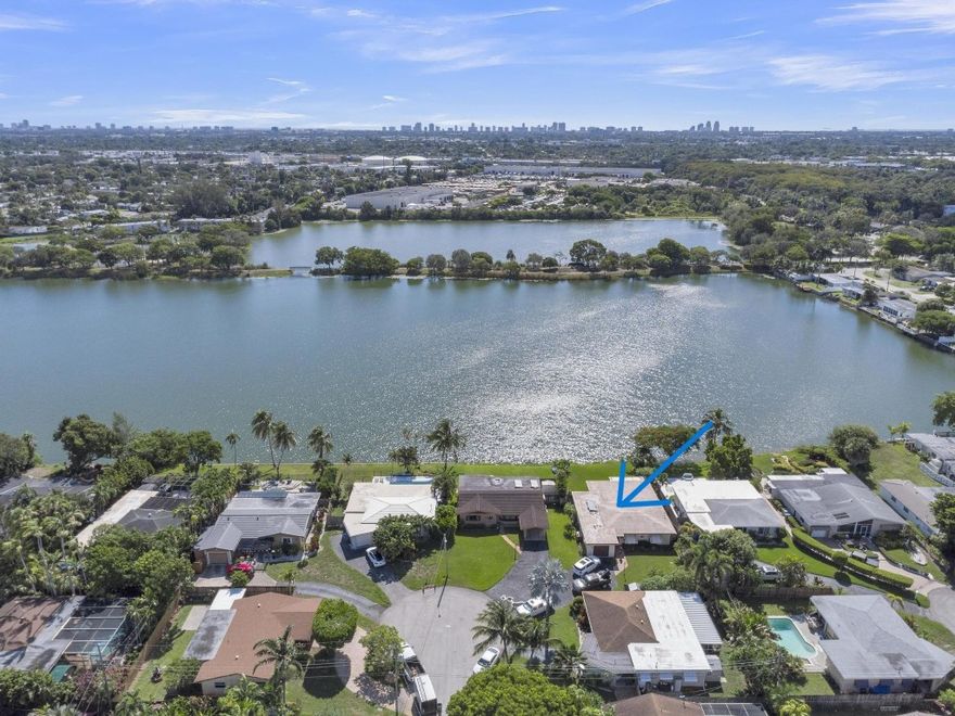 Lakefront living at its finest in Royal Palm Isles! Enjoy serene lake views in this spacious 3BR/2BA, 1-car garage home, situated in the back corner of a quiet cul-de-sac. Impact windows, house filtration system/water softener and a whole-home standby generator provide full storm protection and continuous comfort. Brand new waterproof vinyl flooring & fresh paint throughout. Updated kitchen features flat panel solid wood cabinets, granite countertops, and a large peninsula for dining and entertaining. Two AC units, an 8-car driveway, separate laundry room, original living room plus a huge bonus family room. Close to Royal Palm Park, Easterlin Park, Oakland Bark Dog Park, and i95 makes his location ideal. Only 1 neighborhood entrance/exit gives the feel of a private community.