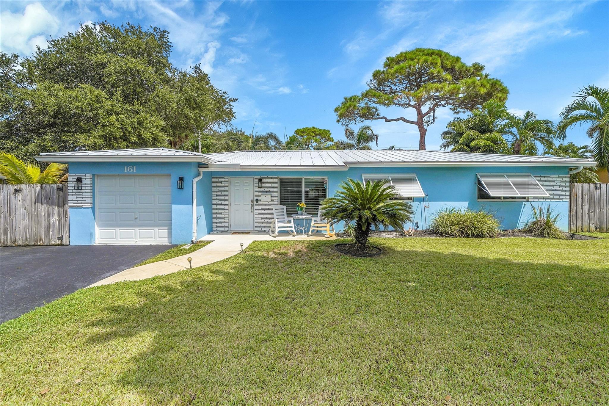 Move right in to this updated 3BR/2BA home in the desirable Norwood community of Pompano Beach. Offering 1,570 sq ft under air, this property features a new roof (2024), new impact windows (2024), newer AC, and new garage door. The open kitchen has stainless steel appliances, granite counters, and light cabinetry. Flexible layout with two sitting areas, plus a large backyard with patio and plenty of room for a pool. Prime east side location just minutes to beaches, shopping, and dining.