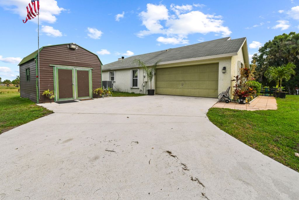Photo of 9340 Carlton Road, Port Saint Lucie, FL 34987 (MLS # B26020891)